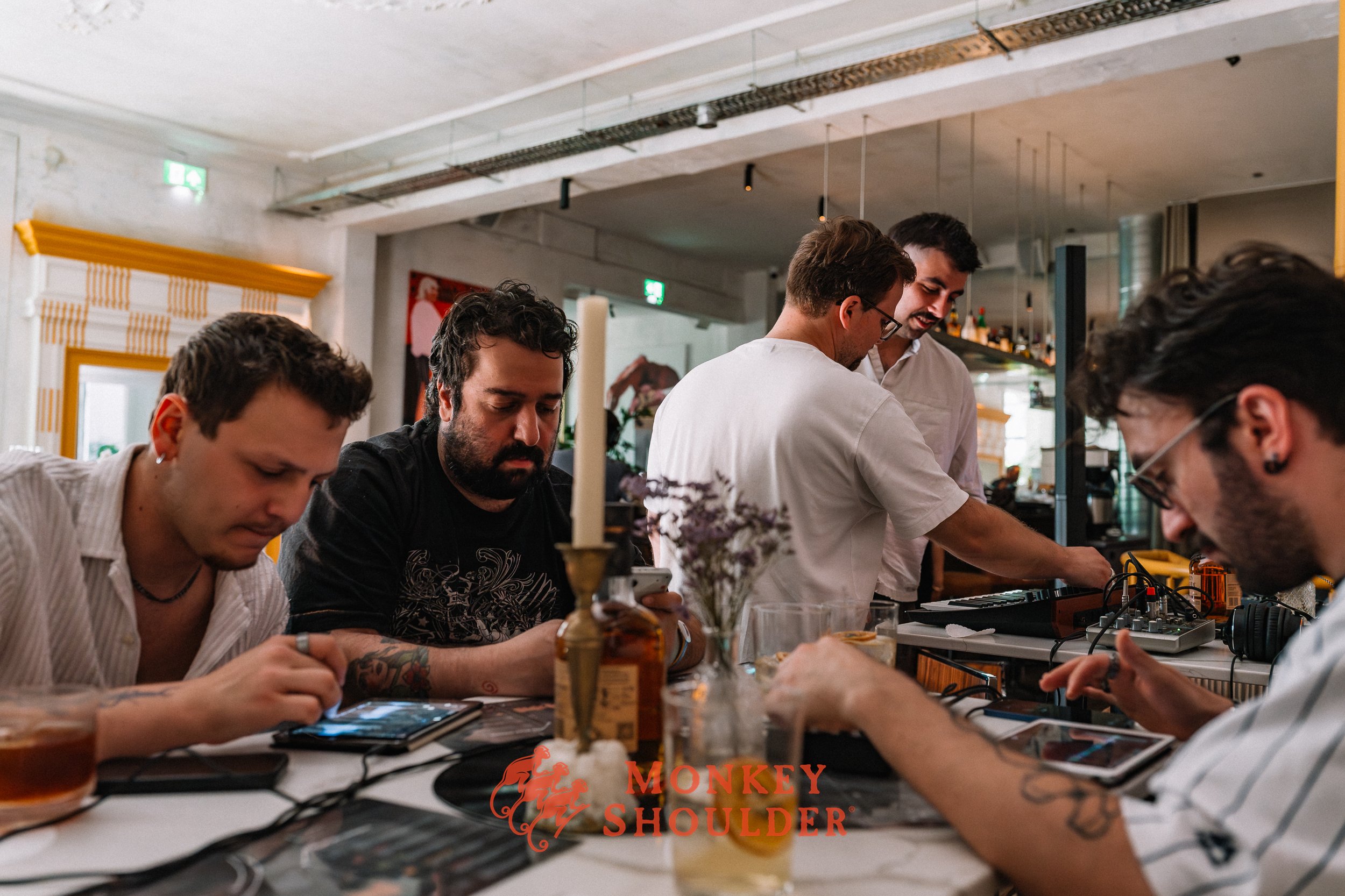 Bartenders at work during the Blended Beats workshop for Monkey Shoulder in The Hague